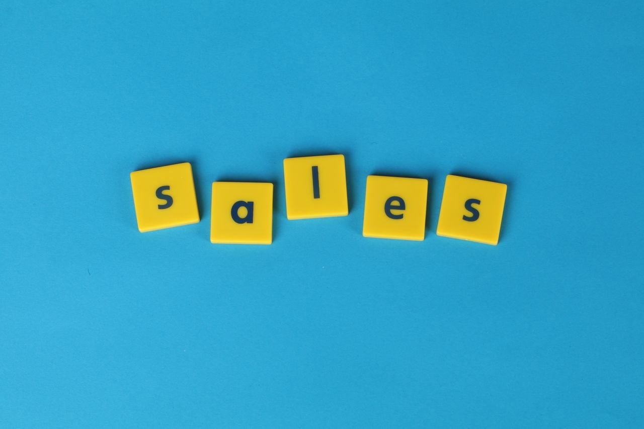 Mastering the First Impression: Your intriguing post title goes here Yellow Scrabble tiles spelling 'sales' on a vibrant blue background. Perfect for marketing and business themes.